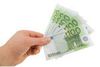 man-s-hand-with-the-bills-of-one-hundred-euros_71082112[1].jpg